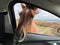 Closeup shot of an Icelandic horse near the window of a car