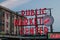 Closeup shot of an illuminated public market center sign in Seattle