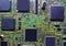 Closeup shot of the integrated electric circuits of a green chip