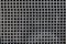 Closeup shot of an iron mesh with square textured pattern