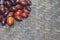 Closeup shot of jujubes bunch on a thatch table surface