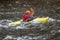 Closeup shot of a kayaker in a yellow boat on the Youghiogheny River near Friendsville, Maryland