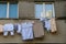 Closeup shot of Laundry dries under the windows of a high-rise building