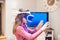 Closeup shot of a little girl trying to touch the object she sees with the virtual reality glasses