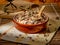 Closeup shot of long grain wild rice mix in a plate with a wooden spoon of a piece of table cover