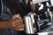 Closeup shot of male barista hands preparing a coffee