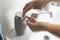 Closeup shot of a male dispensing foamy soap to wash his hands- COVID-19, coronavirus concept