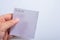 Closeup shot of a male hand holding a white sheet of paper with To do list writing