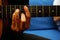 Closeup shot of a man playing guitar holding a barre chord