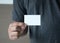 closeup shot Man show white business card Plastic bank-card des