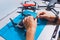 Closeup shot of man working on assembling new surveillance system using quadcopter drone with camera on table with