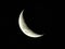 Closeup shot of a mesmerizing waning crescent moon on a black background