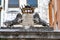 Closeup shot of a metal Doge\'s crown and two Venetian lions holding a shield adorn in Venice, Italy