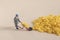 Closeup shot of a mini construction worker figurine working on corn flakes