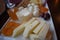 Closeup shot of mixed cheese plate with garnishes, charcuterie