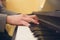 Closeup shot of a musician playing on piano with hands in focus