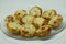 Closeup shot of newly cooked potato croquettes on a clear plate