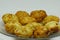 Closeup shot of newly cooked potato croquettes on a clear plate