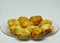 Closeup shot of newly cooked potato croquettes on a clear plate