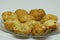 Closeup shot of newly cooked potato croquettes on a clear plate