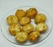 Closeup shot of newly cooked potato croquettes on a clear plate