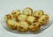 Closeup shot of newly cooked potato croquettes on a clear plate