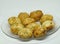 Closeup shot of newly cooked potato croquettes on a clear plate