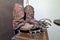 Closeup shot of old dusty cowboy boots with steel crampons for ice climbing