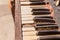 Closeup shot of an old piano keyboard with dusty damaged keys