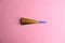 Closeup shot of a party noisemaker isolated on a pink background
