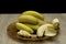 Closeup shot of a pate with fresh bananas on a wooden table