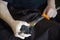 Closeup shot of a person assembling the handle of a traditional Japanese katana sword