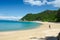 Closeup shot of a person on the beach and the Abel Tasman Track, New Zealand