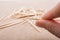 Closeup shot of a person holding a toothpick