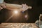 Closeup shot of a person using a rolling pin to prepare cookie dough