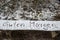 Closeup shot of the phrase Guten Morgen written with finger on snow.
