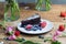 Closeup shot of a piece of brownie cake with blueberries and strawberries