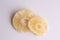 Closeup shot of a piece of dried pineapple fruit in color background