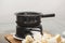 Closeup shot of pieces of bread and a cooker on a small gas stove