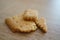 Closeup shot of pieces of butter cookie on a wooden surface