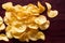 Closeup shot of a pile of crispy potato chips