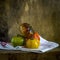 Closeup shot of a pile of heirloom tomatoes  on a cloth surface