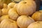 Closeup shot of a pile of pumpkins at a market