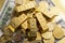 Closeup shot of a pile of shiny gold coins and bars