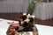 Closeup shot of a pineapple decorated with flowers on an event table