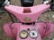 Closeup shot of pink Vespa in the street