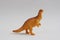 Closeup shot of plastic toy with dinosaur shape isolated on white background