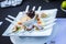 Closeup shot of a plate of colorful seafood on a black table