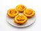 Closeup shot of Portuguese custard tarts isolated on a white background