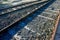 Closeup shot of a railway road, rails and cross ties on a sunny day